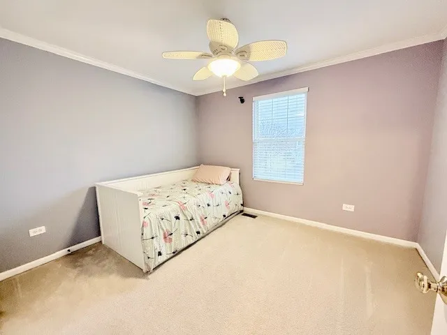 a room with a bed and a chandelier