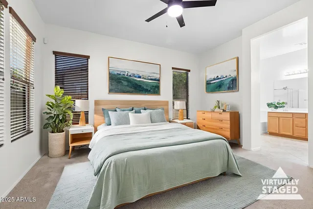 a bedroom with bed and potted plant