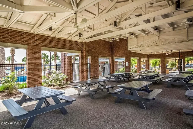 a view of street with building and trees in the background