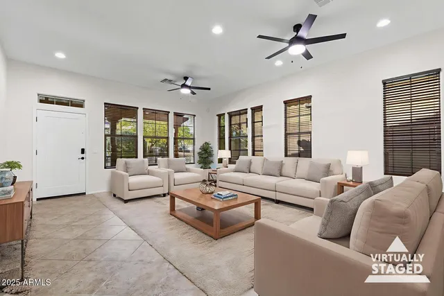 a living room with furniture and a large window