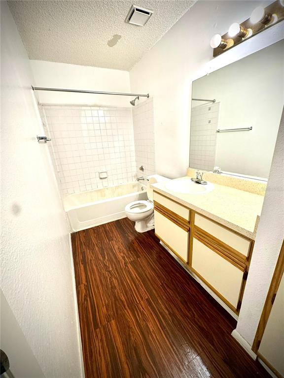 232 Afton Square, Unit 309 Altamonte Springs, FL 32714 - Photo 12 of 26 a bathroom with a sink a toilet and shower