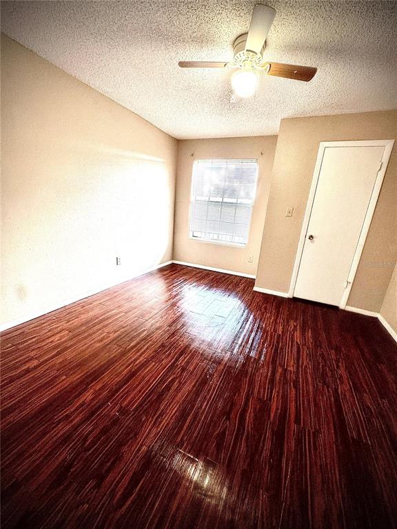 232 Afton Square, Unit 309 Altamonte Springs, FL 32714 - Photo 16 of 26 wooden floor in an empty room with a window