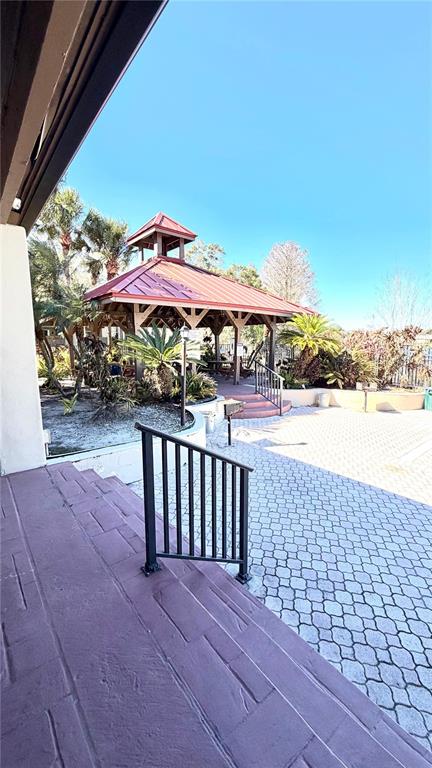 232 Afton Square, Unit 309 Altamonte Springs, FL 32714 - Photo 21 of 26 a view of a patio with a table and chairs