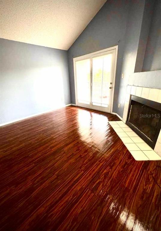 232 Afton Square, Unit 309 Altamonte Springs, FL 32714 - Photo 5 of 26 a view of an empty room with wooden floor and a window