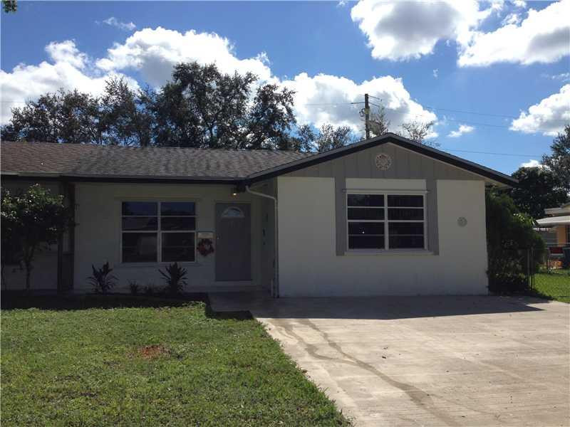 9424 Southwest 52nd Street Cooper City, FL 33328 - Photo 1 of 1 a front view of a house with garden