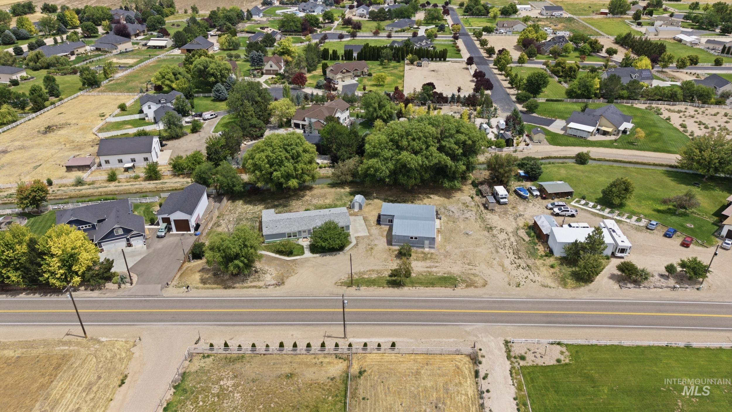 7422 Track Road Nampa, ID 83686 - Photo 45 of 50 Expansive aerial landscape featuring a mix of agricultural fields and developed residential parcels