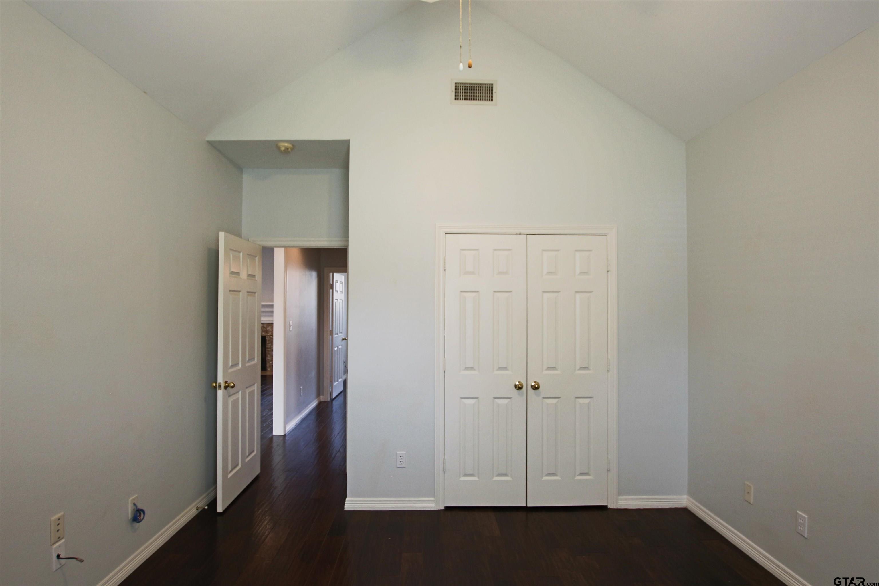 5707 Nicholson Drive Tyler, TX 75707 - Photo 11 of 23 an empty room with wooden floor