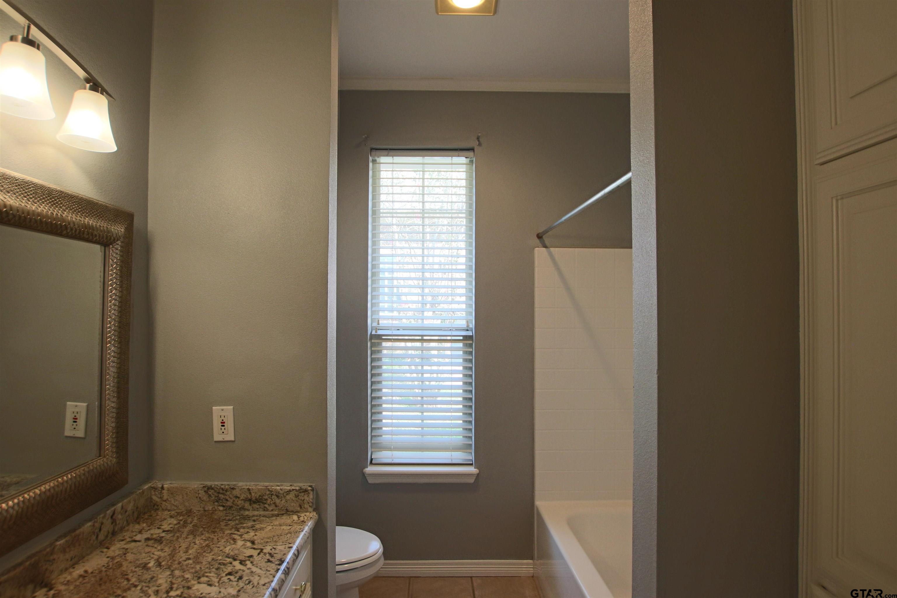 5707 Nicholson Drive Tyler, TX 75707 - Photo 20 of 23 a view of room with window and front door