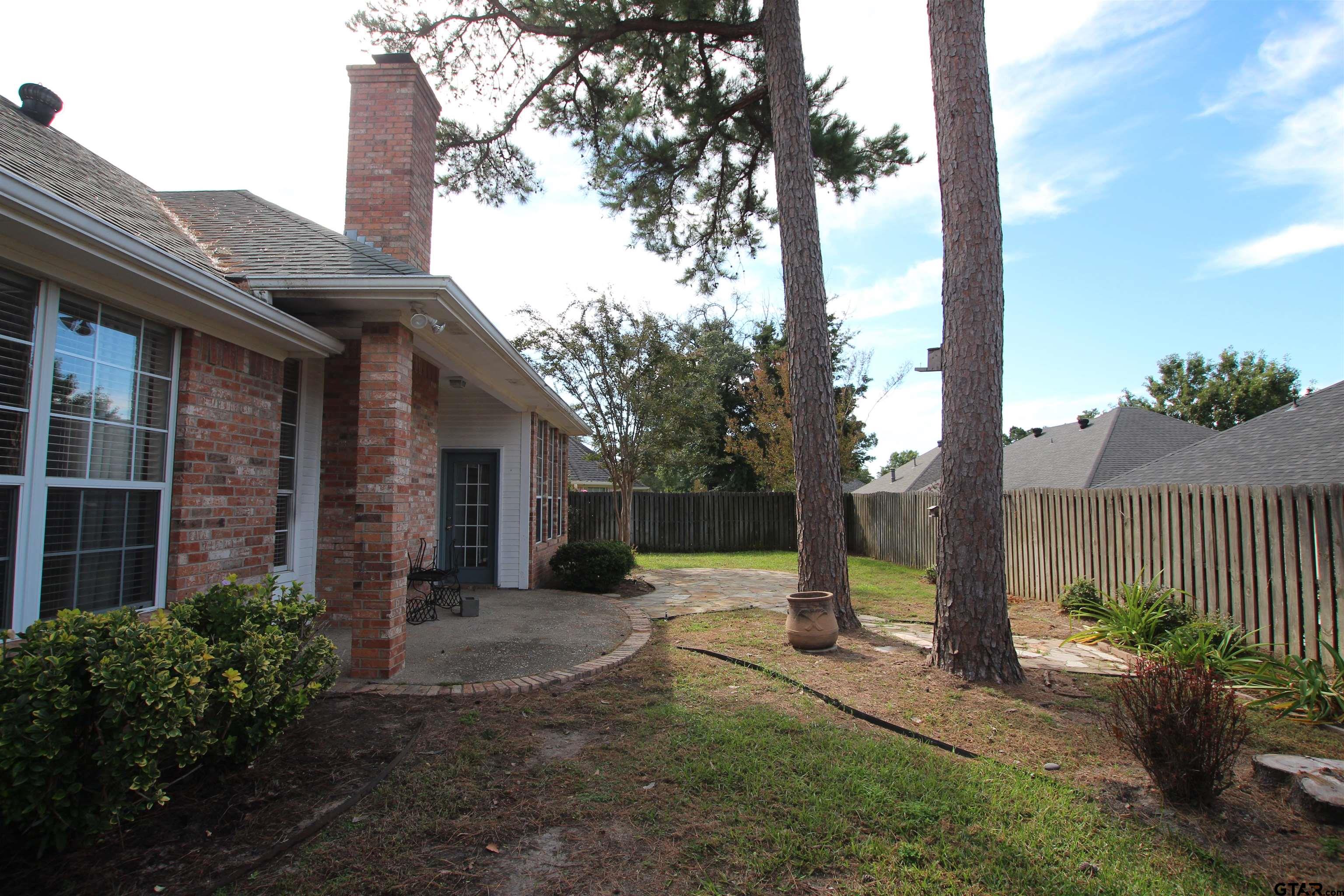 5707 Nicholson Drive Tyler, TX 75707 - Photo 22 of 23 a view of a house with backyard and tree