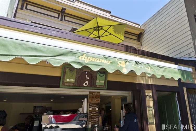 a store with yellow umbrella