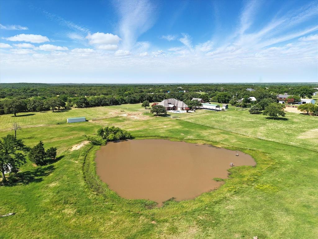 12886 St John Road Pilot Point, TX 76258 - Photo 31 of 35 Aerial view of a nearby body of water and a forest