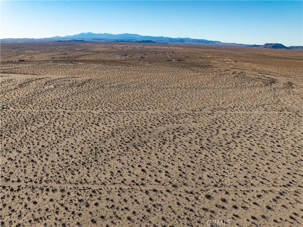 0 Saturn Drive Joshua Tree, CA 92252 - Photo 11 of 23 a view of an ocean beach and mountain