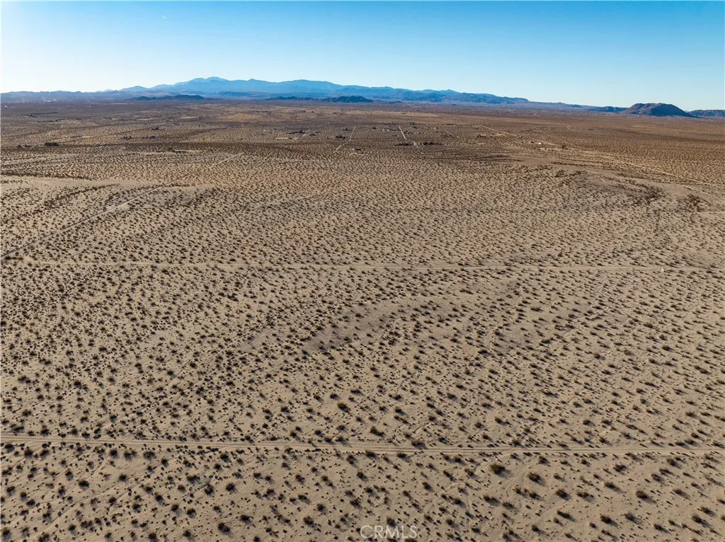 0 Saturn Drive Joshua Tree, CA 92252 - Photo 11 of 23 a view of an ocean beach and mountain
