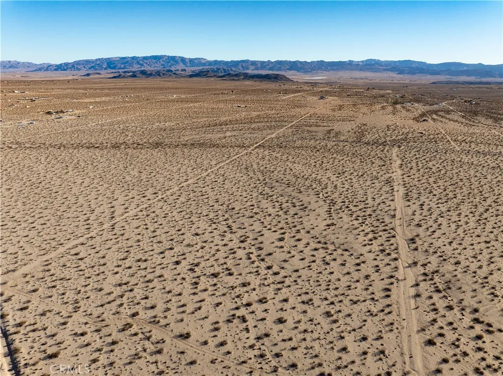 0 Saturn Drive Joshua Tree, CA 92252 - Photo 14 of 23 a view of an ocean beach and mountain
