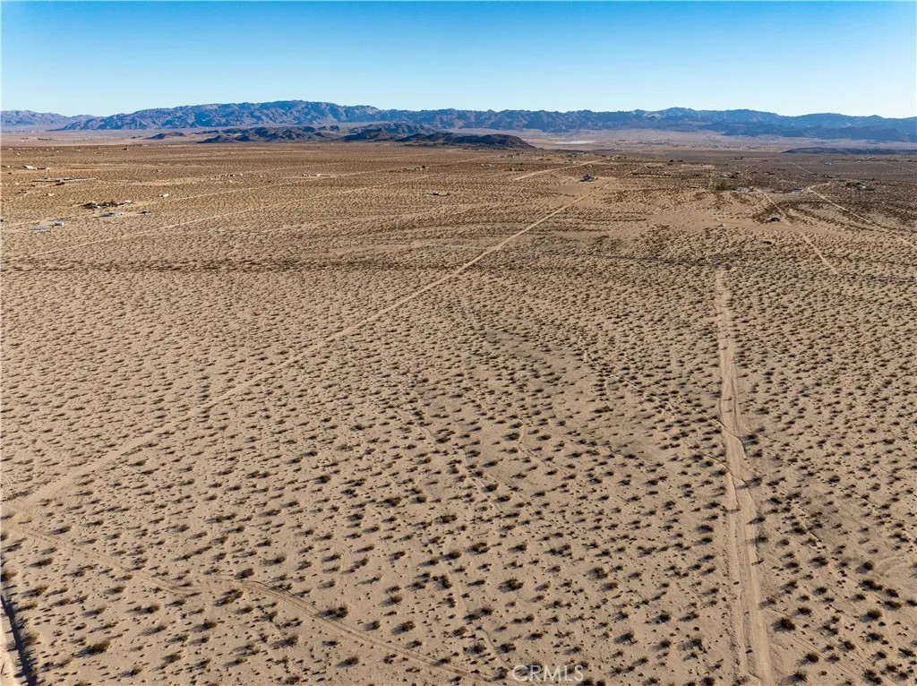 0 Saturn Drive Joshua Tree, CA 92252 - Photo 14 of 23 a view of an ocean beach and mountain