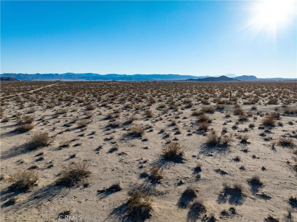 0 Saturn Drive Joshua Tree, CA 92252 - Photo 21 of 23 a view of a large body of water and mountain in the back