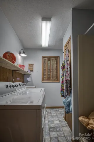 a bed room with a bed and a chandelier