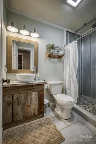 a living room with furniture a piano and a bookshelf