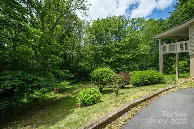 a view of a garden with a building in front of it