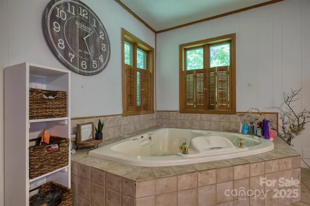a bath tub sitting next to a blue wall
