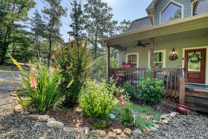 87 Harbin Court Morganton, GA 30560 - Photo 14 of 63 a view of a house with brick walls and potted plants