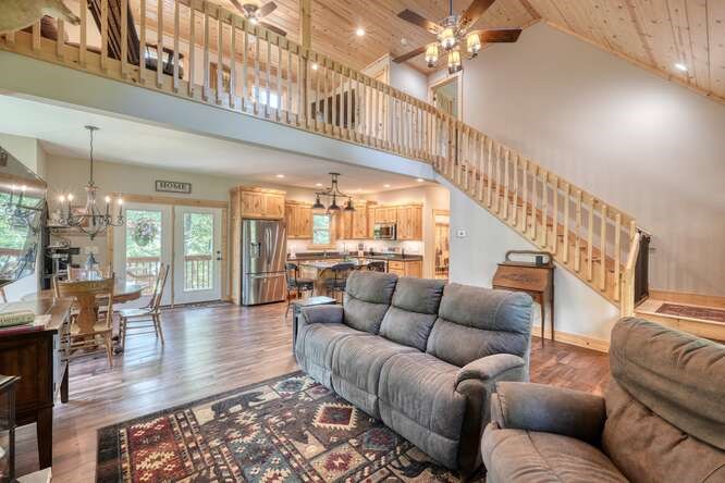 87 Harbin Court Morganton, GA 30560 - Photo 17 of 63 a living room with furniture ceiling fan and a rug
