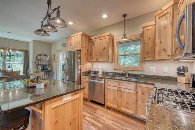 87 Harbin Court Morganton, GA 30560 - Photo 2 of 63 a kitchen with stainless steel appliances granite countertop a sink a stove and cabinets