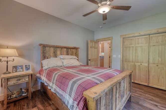 87 Harbin Court Morganton, GA 30560 - Photo 22 of 63 a bedroom with a bed and a chandelier