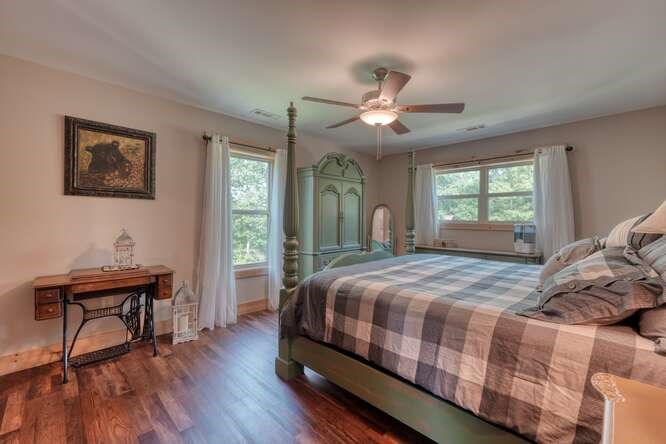 87 Harbin Court Morganton, GA 30560 - Photo 28 of 63 a bedroom with a bed and a table in it