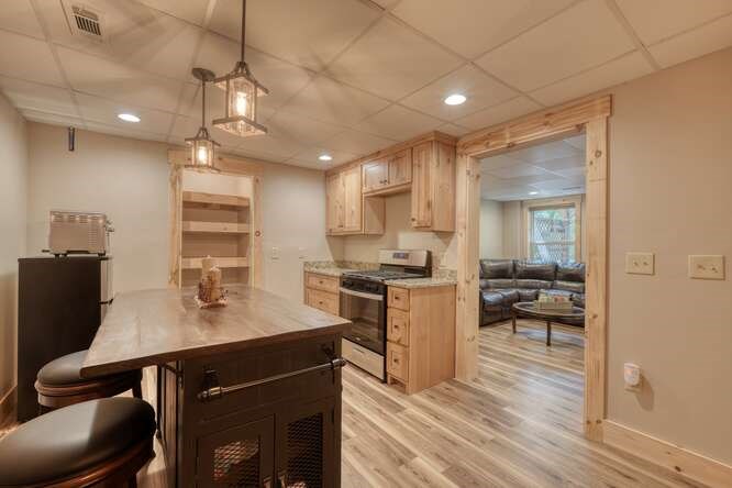 87 Harbin Court Morganton, GA 30560 - Photo 30 of 63 a kitchen with a sink cabinets and wooden floor
