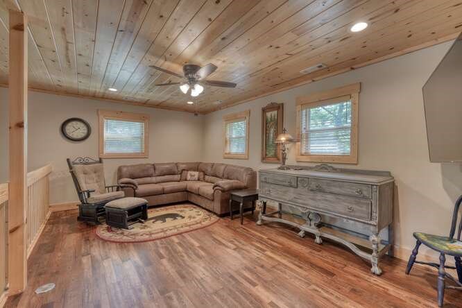 87 Harbin Court Morganton, GA 30560 - Photo 34 of 63 a living room with furniture and a wooden floor