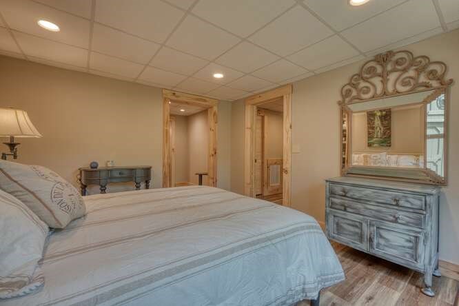 87 Harbin Court Morganton, GA 30560 - Photo 35 of 63 a large bedroom with a bed and wooden floor