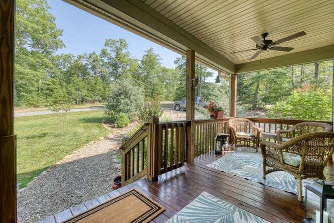 87 Harbin Court Morganton, GA 30560 - Photo 38 of 63 a view of a balcony with chair and wooden floor