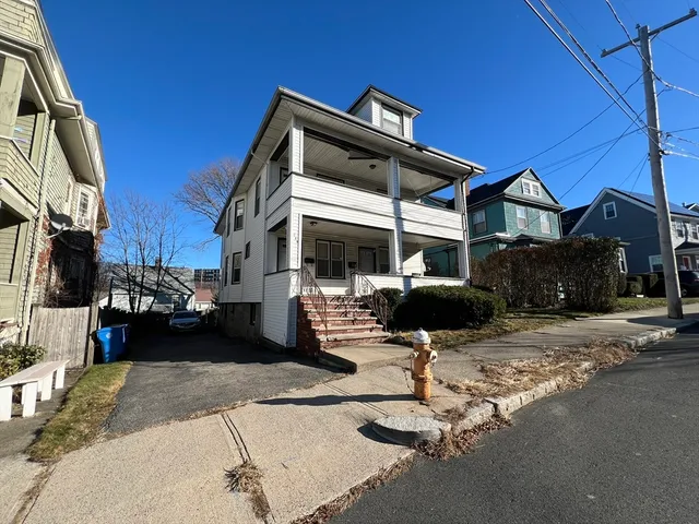 a front view of a house with porch and livingroom