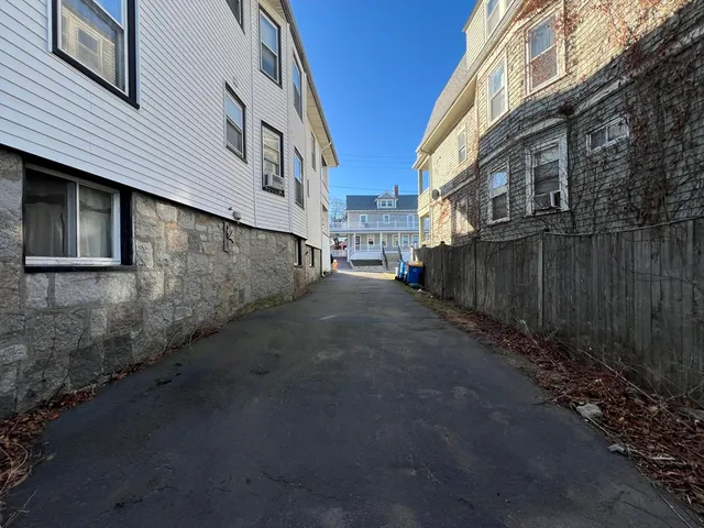 a view of a street with brick house