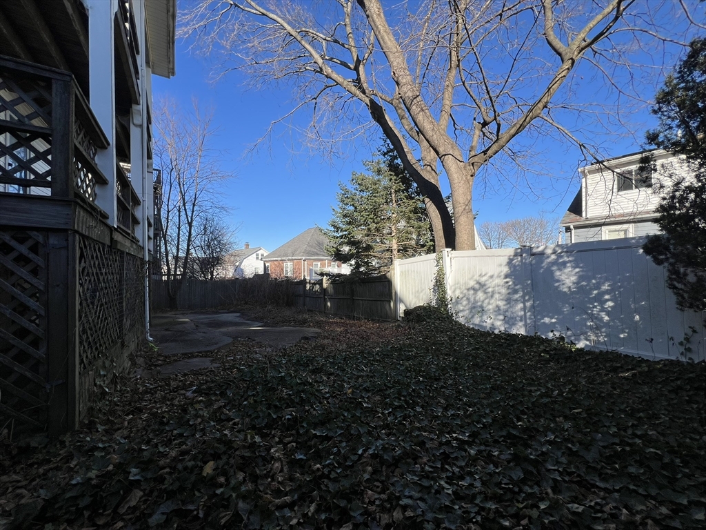 169 Grovers Avenue Winthrop, MA 02152 - Photo 8 of 31 a view of a backyard with large trees