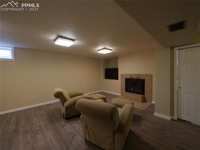 402 Yellowstone Road Colorado Springs, CO 80910 - Photo 20 of 28 Featuring a wood burning fireplace