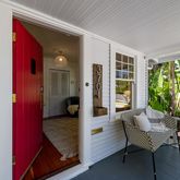 a balcony with furniture and a potted plant