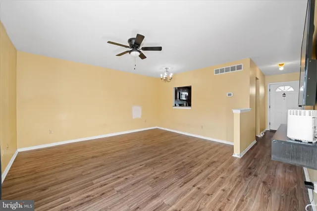a view of a livingroom with wooden floor