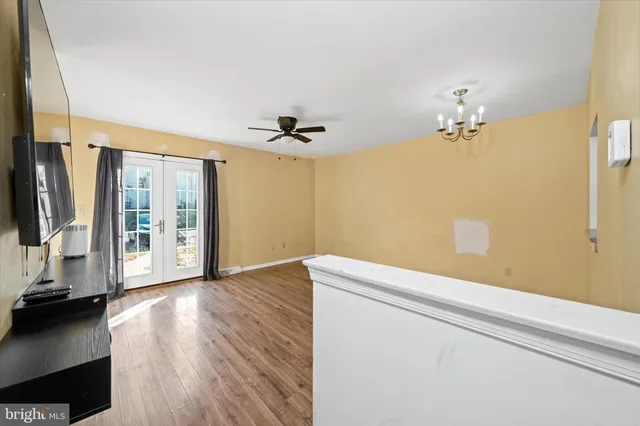 a view of livingroom with hardwood floor and a ceiling fan
