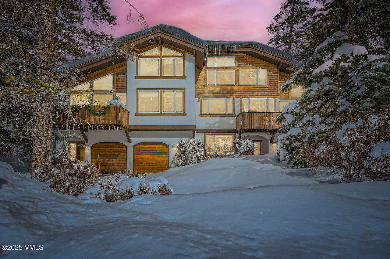 4173 Spruce Way Vail, CO 81657 - Photo 3 of 29 a front view of a house with garden