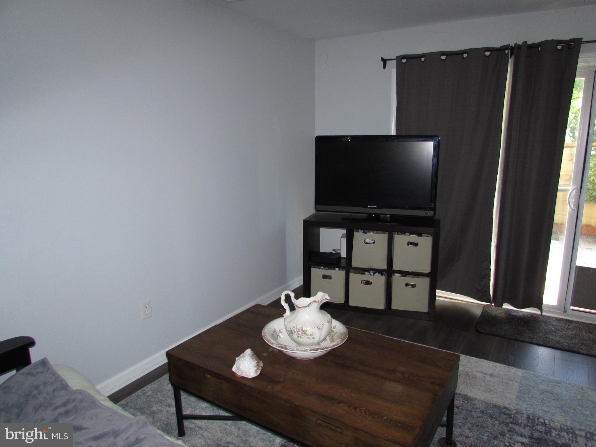 1745 Leisure Way Crofton, MD 21114 - Photo 5 of 14 a living room with furniture and a flat screen tv