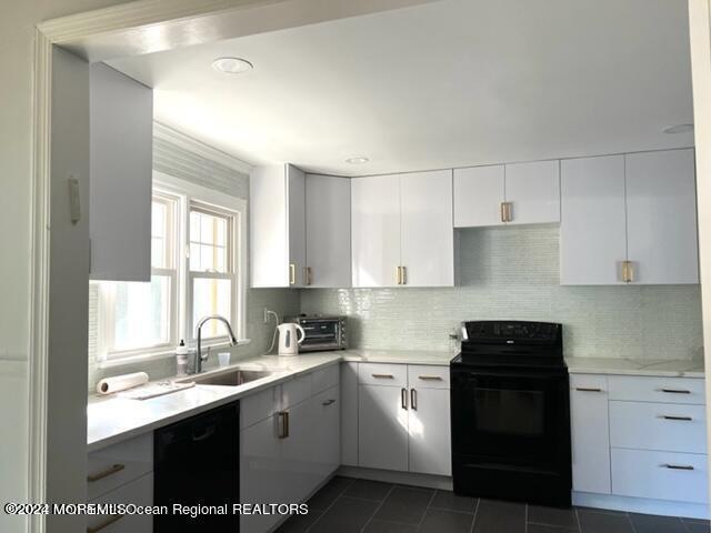 742 Myrtle Avenue West Allenhurst, NJ 07711 - Photo 4 of 13 a kitchen with a sink stove top oven and cabinets