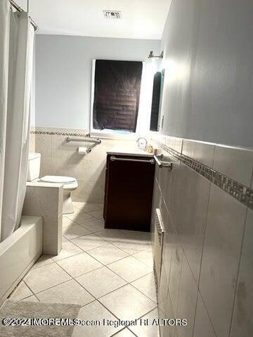 742 Myrtle Avenue West Allenhurst, NJ 07711 - Photo 6 of 13 a bathroom with a bathtub and a sink