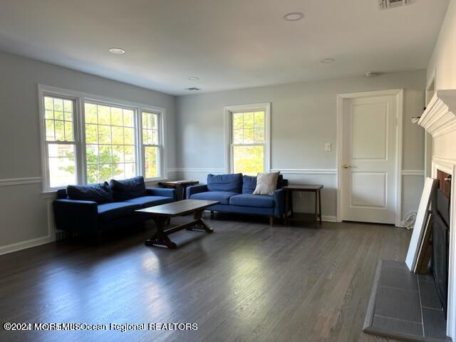 742 Myrtle Avenue West Allenhurst, NJ 07711 - Photo 8 of 13 a living room with furniture a large window and a wooden floor