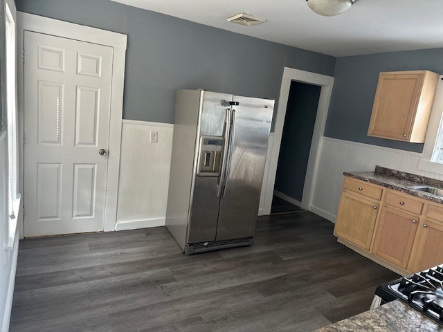 581 Lakeview Avenue, Unit 2 Lowell, MA 01850 - Photo 6 of 10 a kitchen with stainless steel appliances granite countertop a refrigerator and a stove