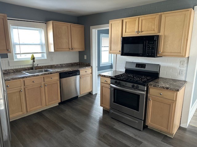 581 Lakeview Avenue, Unit 2 Lowell, MA 01850 - Photo 9 of 10 a kitchen with granite countertop a sink and a stove top oven
