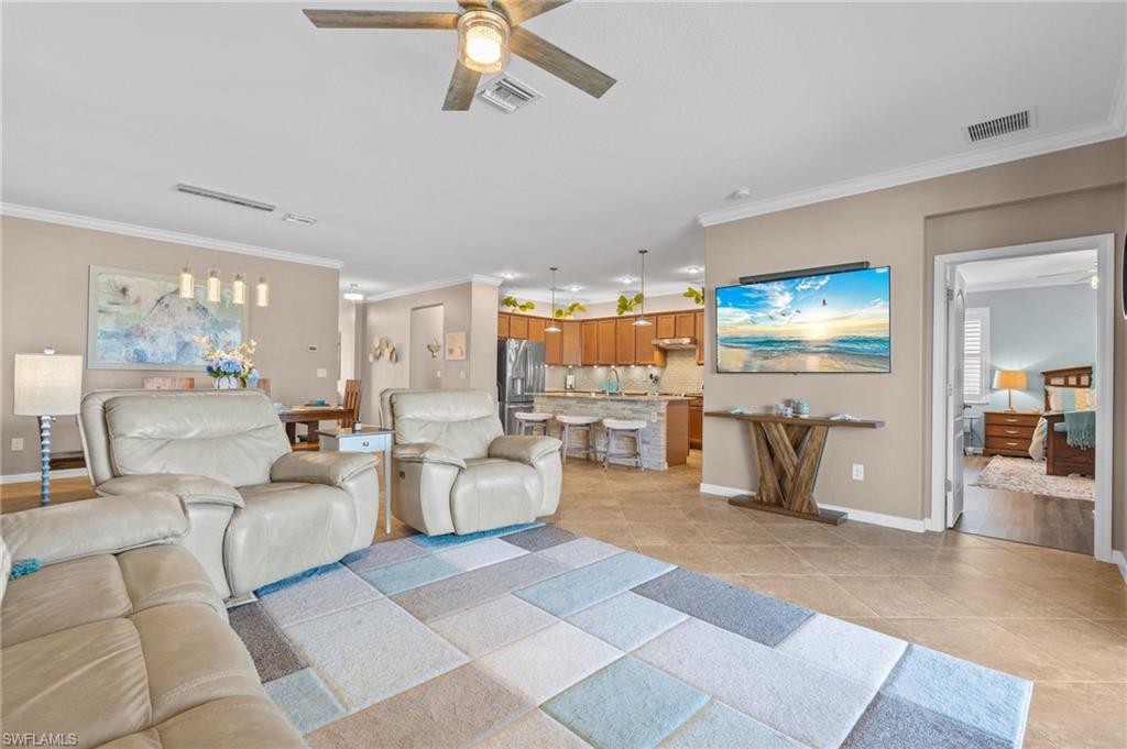 3147 Walnut Grove Lane Alva, FL 33920 - Photo 18 of 45 a living room with furniture and a chandelier