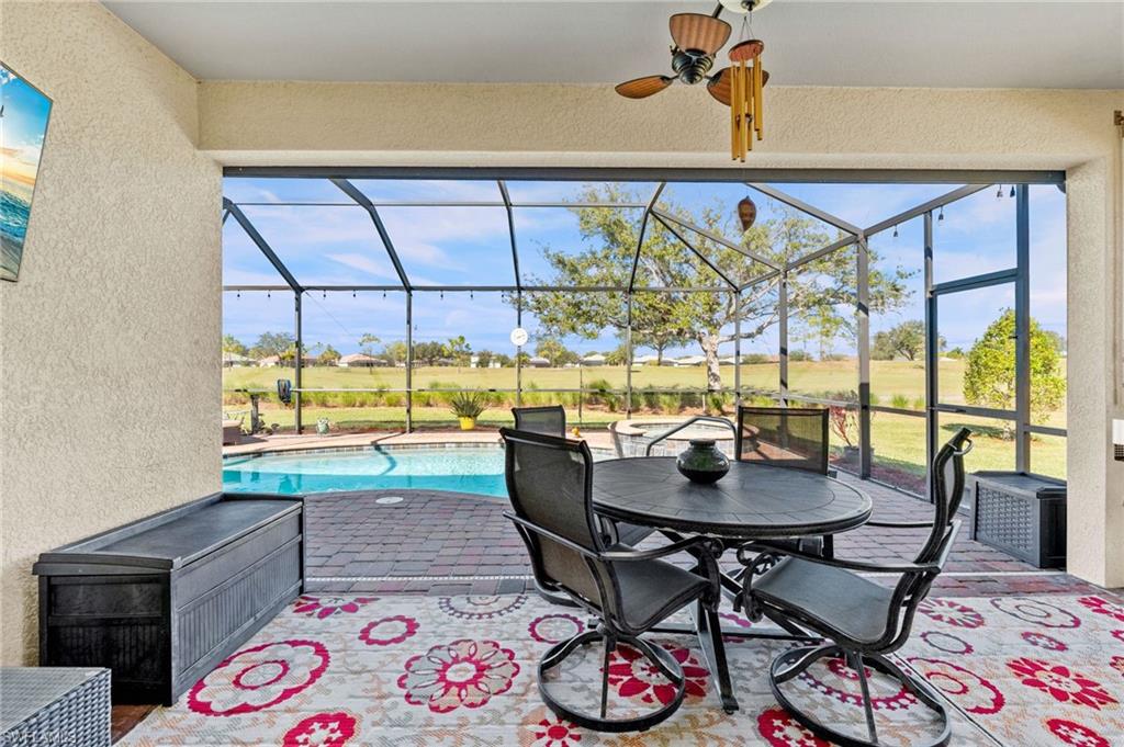3147 Walnut Grove Lane Alva, FL 33920 - Photo 34 of 45 a dining room with furniture and a floor to ceiling window