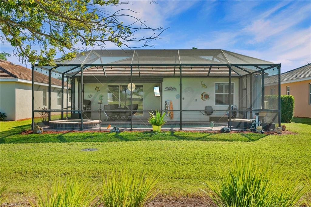 3147 Walnut Grove Lane Alva, FL 33920 - Photo 43 of 45 a view of swimming pool with outdoor seating and yard